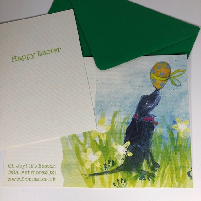 A grinning black labrador balances a gigantic, colourful Easter egg on his nose and thinks OH JOY! IT'S EASTER! Card inscription inside reads HAPPY EASTER