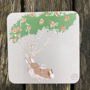 rabbit resting under a rowan tree on a light grey cork backed coaster makes a great gift set with our R placemat.