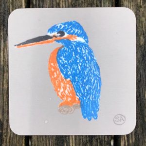 A British fauna coaster showing a brilliantly coloured blue and orange kingfisher on a pale grey-brown background. This coaster will introduce any child or adult to this wonderful british bird.