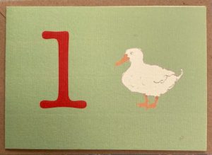 the number one in red , large and one duck have come to celebrate a one year olds first birthday!