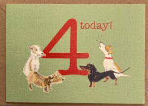 4 dogs, one singing jack russell, 2 terrier and a dachshund, are here to celebrate 4 today!