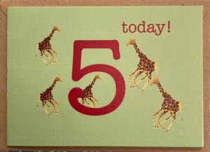 5 giraffes race around in glee, a giant 5 today to say HAPPY BIRTHDAY!