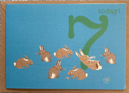 large green number 7 surrounded by 7 rabbits with today! written - to celebrate a 7 year olds birthday