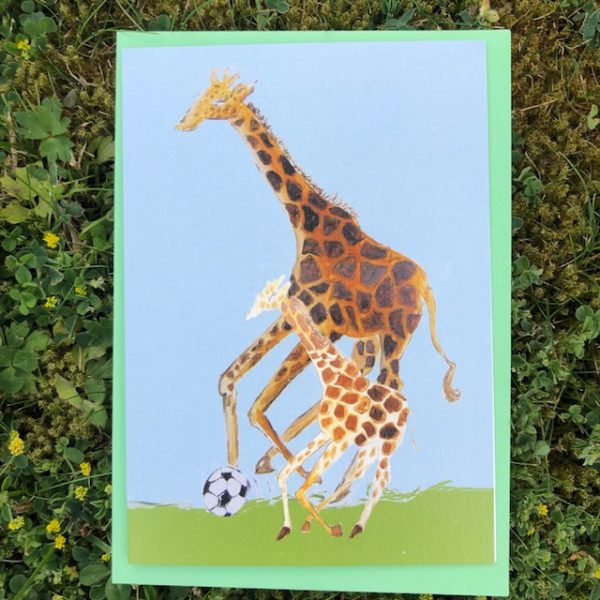 giraffe and small giraffe play football together makes a great father's day card