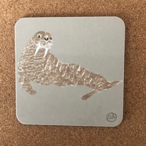 animal coaster of a wonderful wild walrus with large white tusks set against a background reminiscent of unbleached linen. Made of hard wood, coated in melamine with a cork backing. The coaster's size is 100mmx100mmx3.2mm
