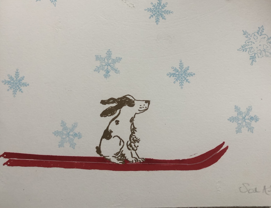 A springer spaniel sits on his red skis . Ears streaming out behind him as he swishes through the snow . The ski is full of intricately drawn snowflakes 
